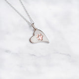 Sterling silver heart paw print jewellery with embedded paw filled with 24k rose gold