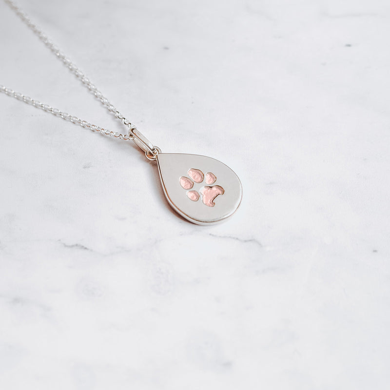 Sterling silver teardrop paw print charm neckalce with embedded paw filled with 24k rose gold