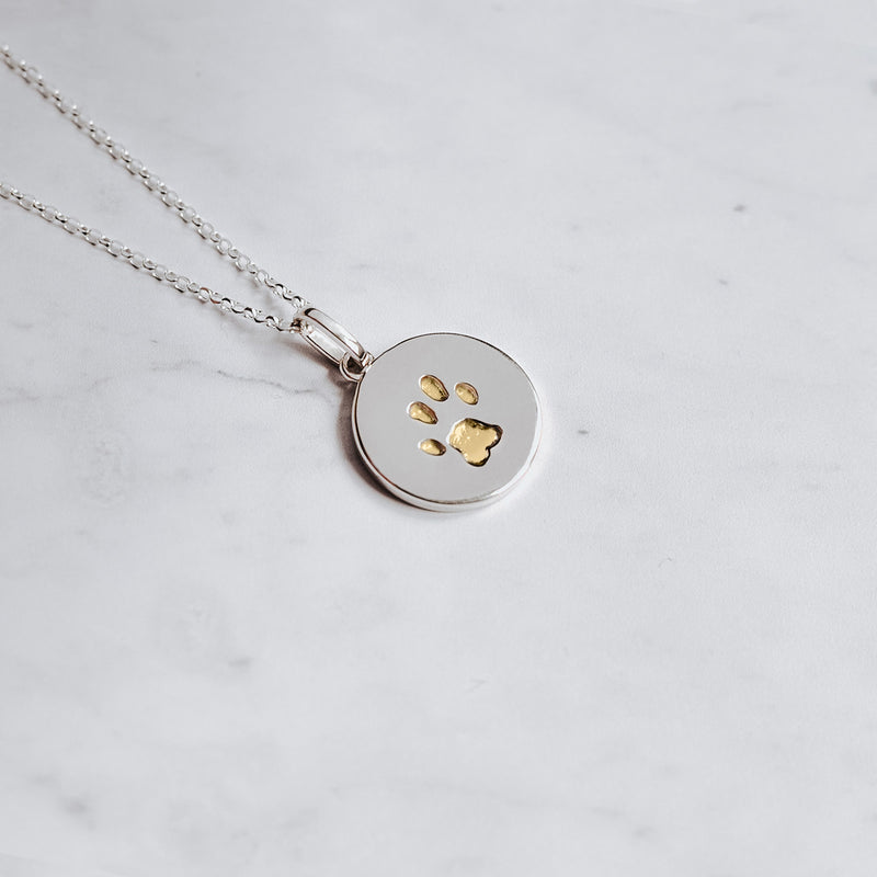 Sterling Silver disc paw print charm necklace with embedded paw print filled with 24k gold