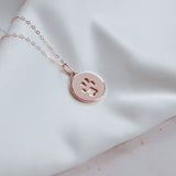 Rose gold circle paw print charm jewellery 