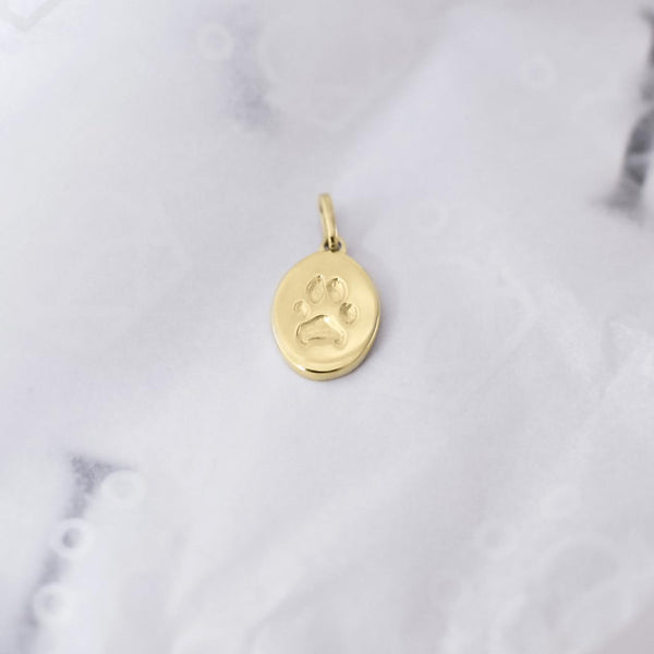 Signature Oval Paw Print Charm In Yellow Gold